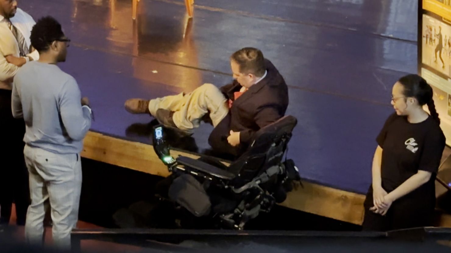 First-term Denver councilmember Chris Hinds dragged himself onto a stage before a political debate Monday due to lack of wheelchair accessibility.