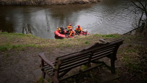 A search dog from Lancashire Police and a crew from Lancashire Fire and Rescue service search the River Wyre near the bench where Bulley's mobile phone was found, in the village of St Michael's on Wyre on February 1, 2023.