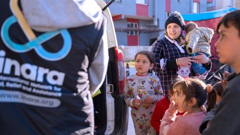 INARA workers hand out aid in Turkey to earthquake survivors.
