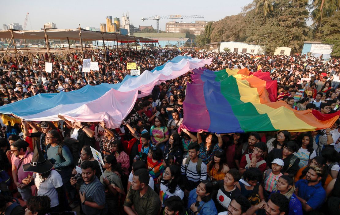 Participants hold flags during Mumbai's 2020 Queer Azadi Pride, an event promoting LGBTQ rights.