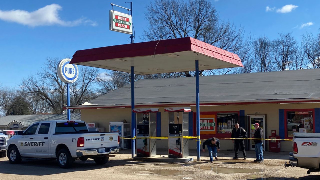 Law enforcement personnel work at the scene of a shooting, Friday, Feb. 17, 2023, in Arkabutla, Miss. Six people were fatally shot Friday in the small town in rural Mississippi near the Tennessee state line, and authorities said they had taken a suspect into custody. 