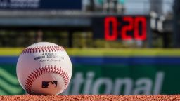 DUNEDIN, FL - FEBRUARY 15:  A detail shot of an Official Rawlings baseball on the field with a pitch clock in the background as new rule changes are demonstrated to assembled media during the On-Field Rules Demonstration at TD Ballpark on Wednesday, February 15, 2023 in Dunedin, Florida. (Photo by Mike Carlson/MLB Photos via Getty Images)