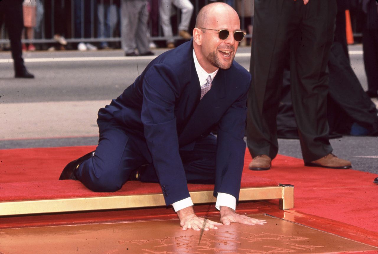 Willis leaves his handprints outside Mann's Chinese Theatre in Hollywood in 1995.