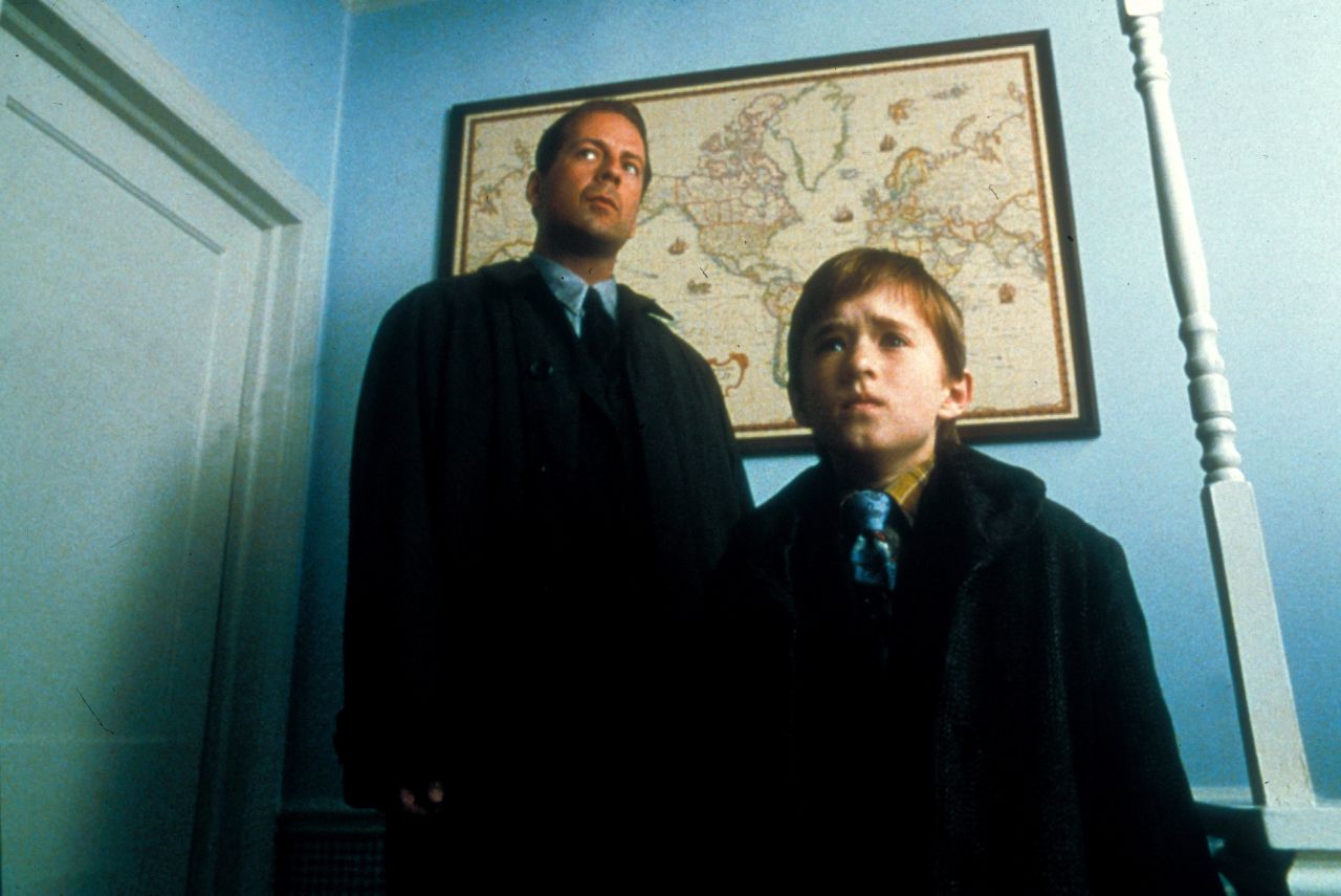 Willis and Haley Joel Osment appear in "The Sixth Sense" in 1999.