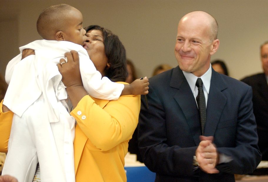 Willis, as a national spokesman for Children in Foster Care, watches Danita Strauss kiss her son Tyler after his adoption was finalized in 2002.