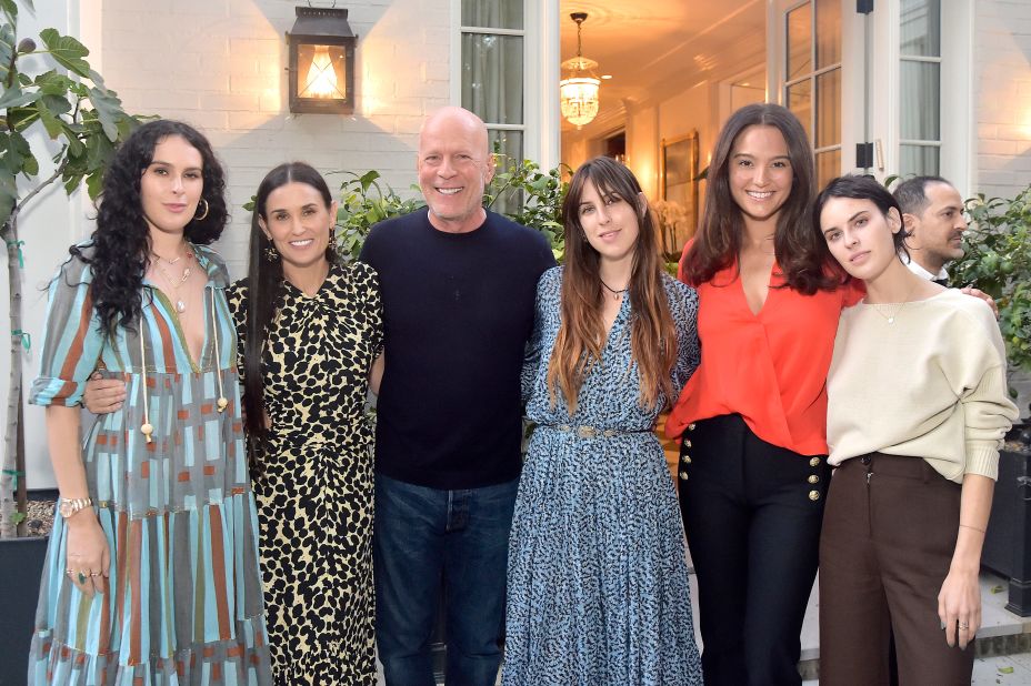 Willis attends Moore's book party in 2019 with their daughters and his second wife, Emma Heming Willis. From left are Rumer Willis, Moore, Bruce Willis, Scout Willis, Emma Heming Willis and Tallulah Willis.