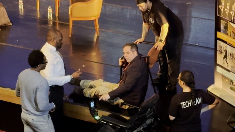 Video: This wheelchair using Denver councilman had to drag himself on to a debate stage | CNN