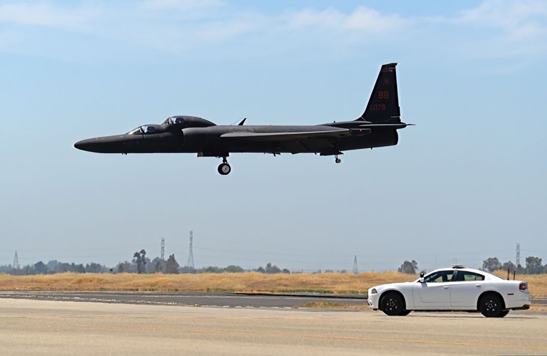 A mobile chase car pursues a U-2 Dragon Lady as it prepares to land at Beale Air Force Base in California in June 2015.