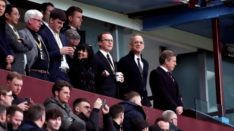 Tom Hanks endures soccer’s highs and lows as Aston Villa succumbs to Arsenal in six goal thriller | CNN