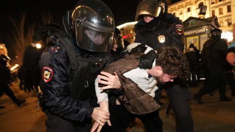 Police officers detain a demonstrator during a protest against Russia's invasion of Ukraine in St. Petersburg on February 27, 2022.