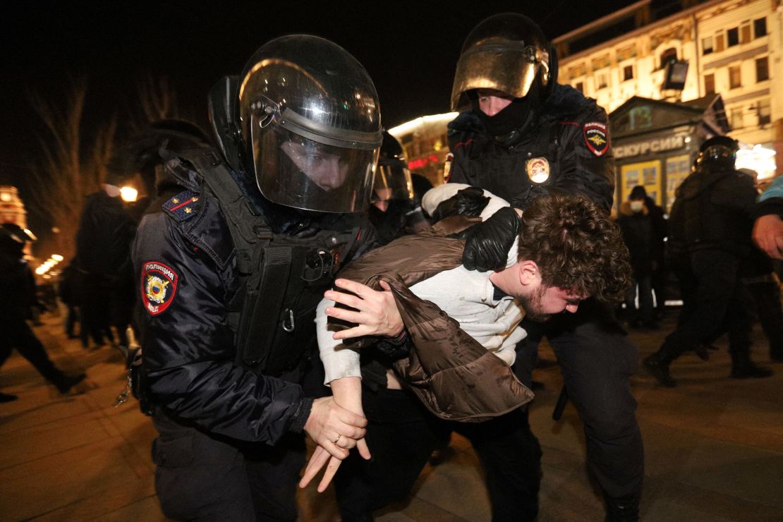 Police officers detain a demonstrator during a protest against Russia's invasion of Ukraine in St. Petersburg on February 27, 2022.