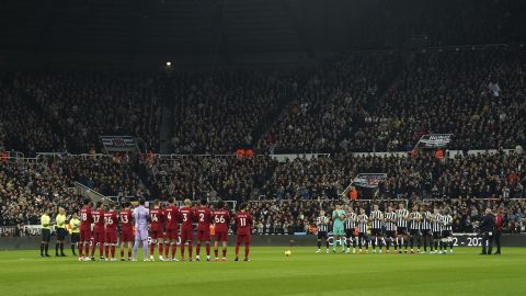 Newcastle United players and Liverpool players hold a minute's applause in memory of Christian Atsu. 