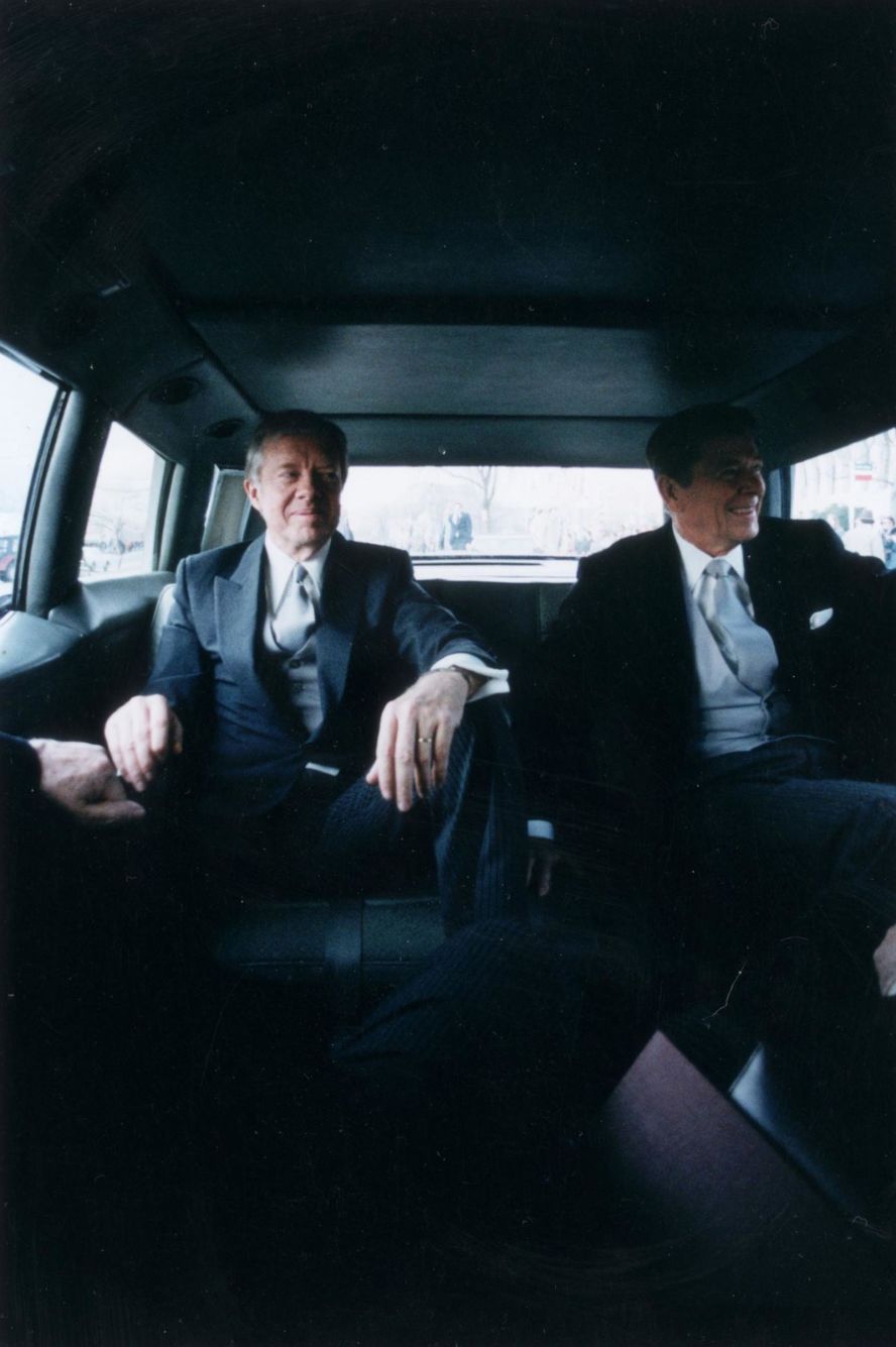 Outgoing President Carter, left, sits with President-elect Ronald Reagan en route to Reagan's inauguration in January 1981. Reagan had defeated Carter in a landslide.