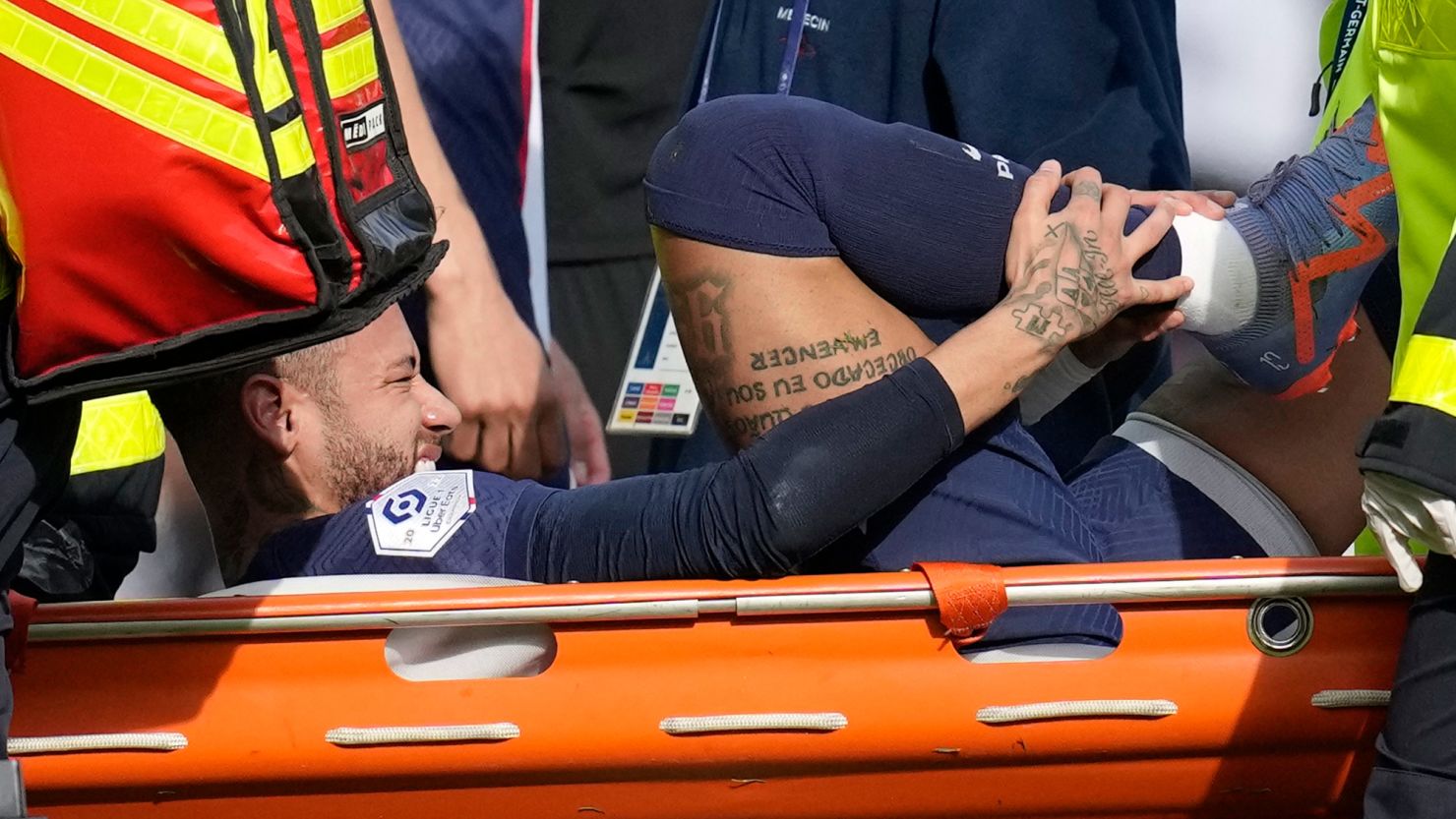 PSG's Neymar is carried off the field on a stretcher against Lille. 
