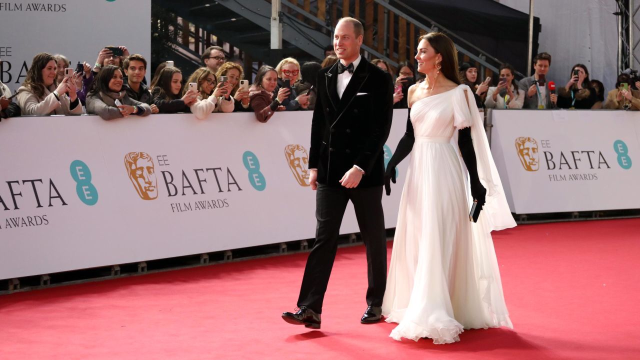 Prince William, Prince of Wales, and Catherine, Princess of Wales walk the red carpet. 