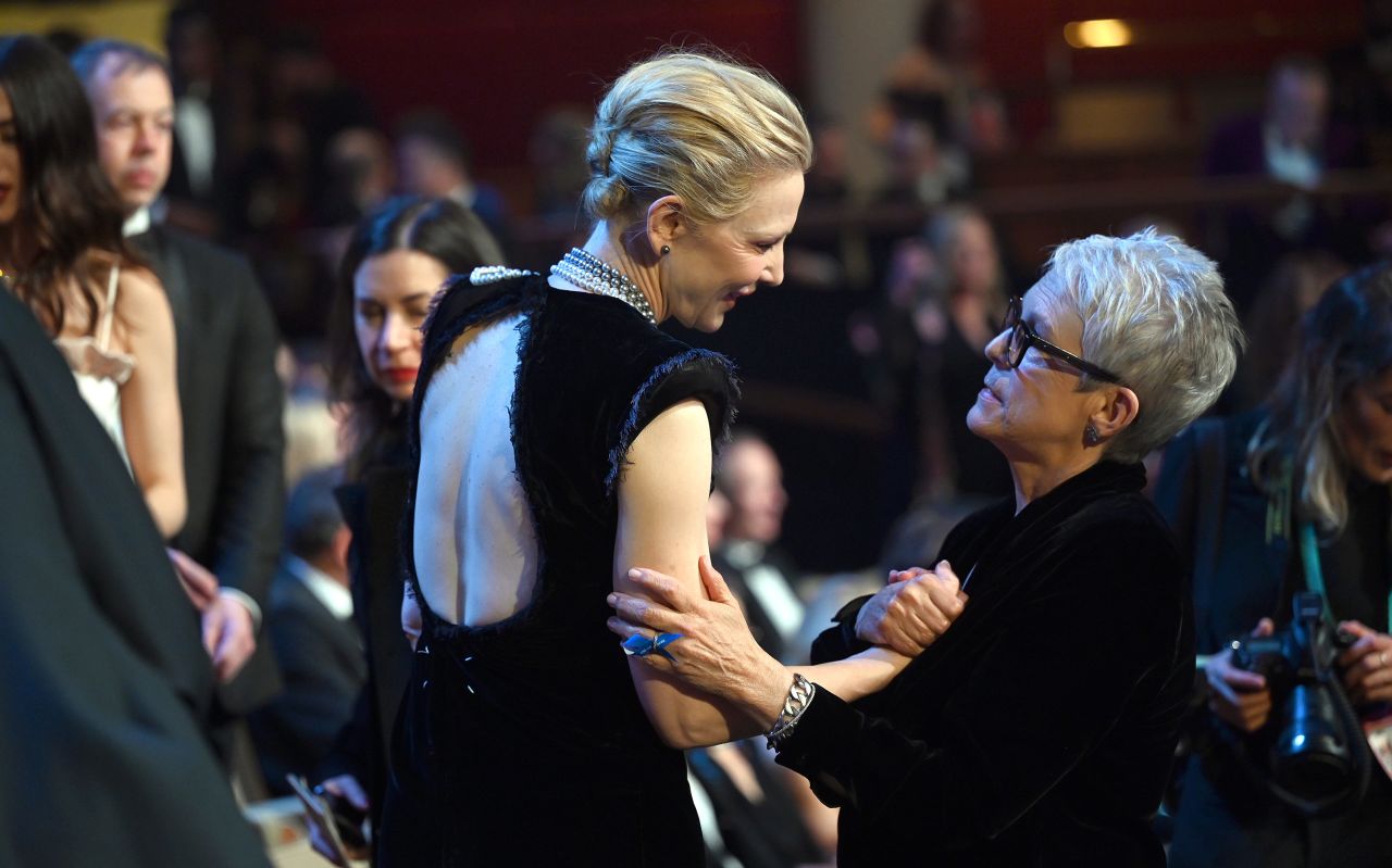 Cate Blanchett and Jamie Lee Curtis greet each other in the crowd. 