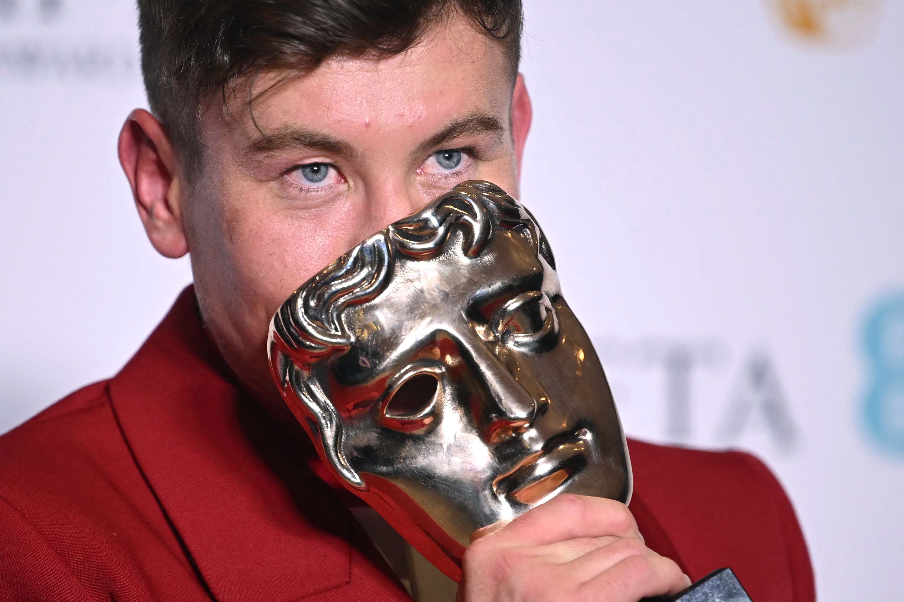 Barry Keoghan poses with his best supporting actor award.