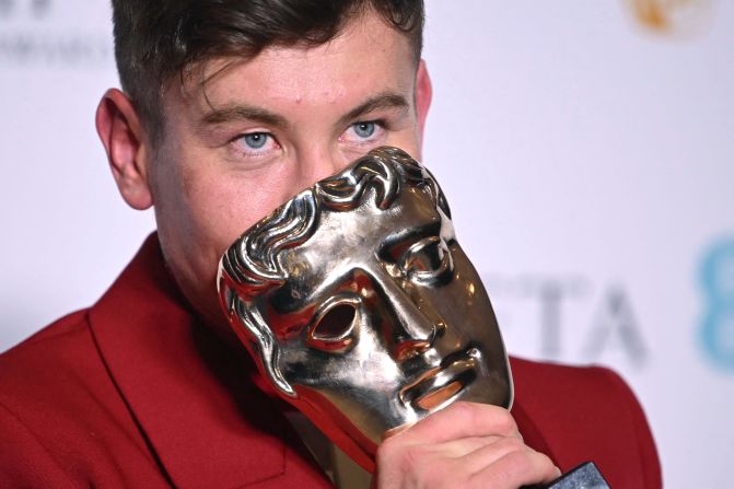 Barry Keoghan poses with his best supporting actor award.