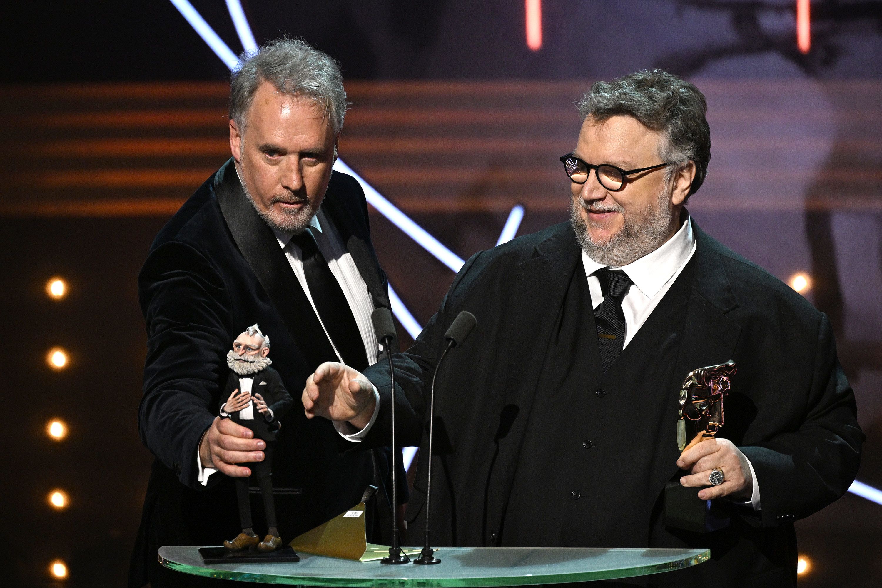 Mark Gustafson and Guillermo del Toro accept the animated film award for Guillermo del Toro's Pinocchio.