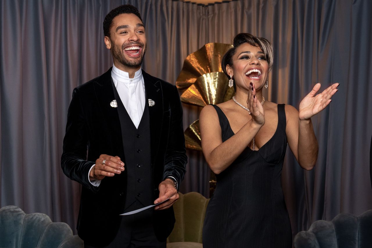 Regé-Jean Page and Ariana DeBose applaud backstage.