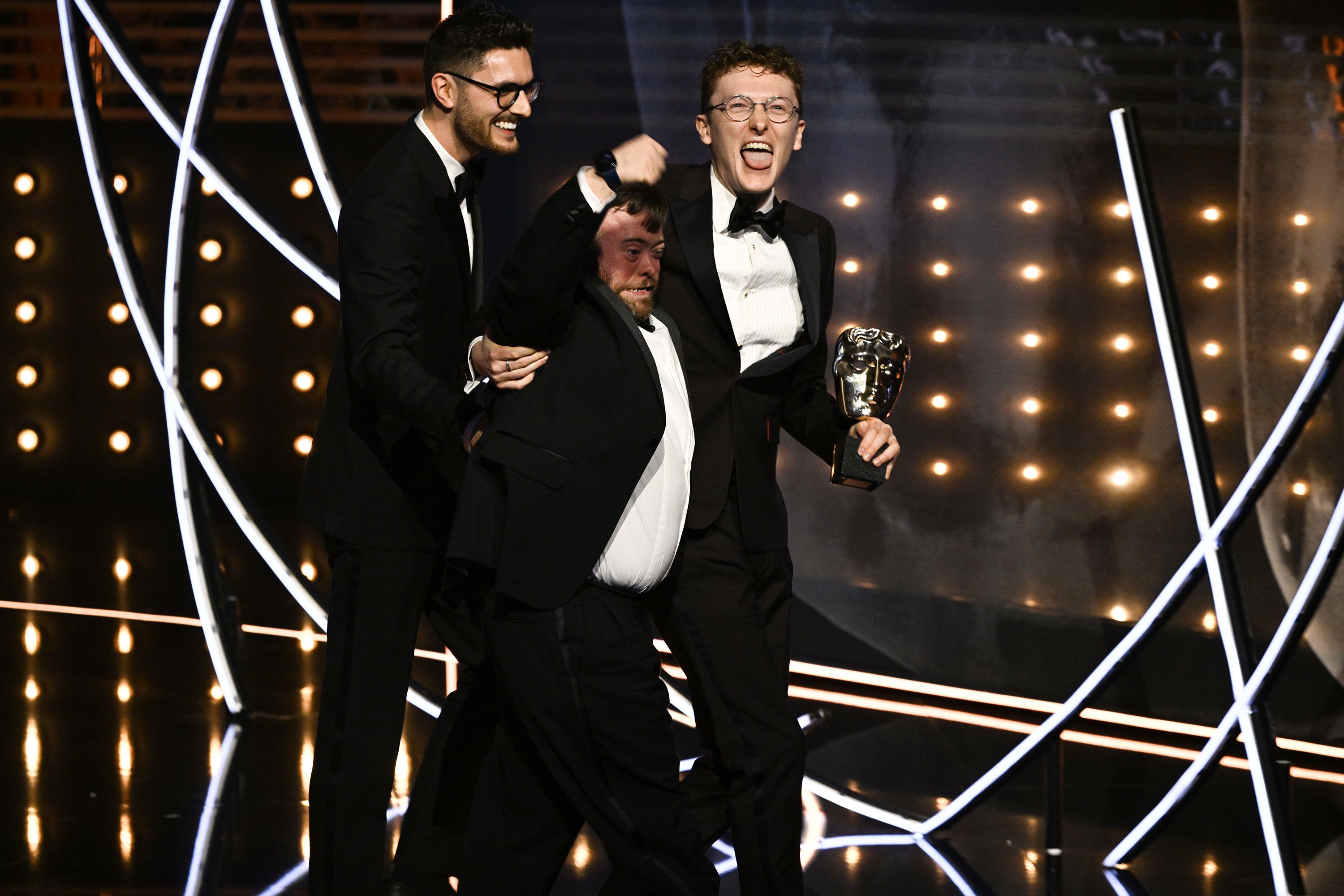 Tom Berkeley, James Martin and Ross White accept the British short film award for An Irish Goodbye.