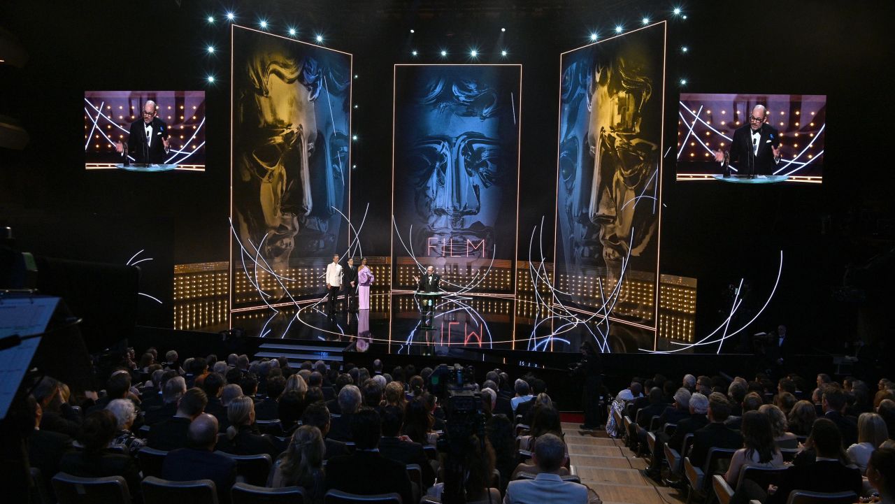 Edward Berger accepts the adapted screenplay award for "All Quiet on the Western Front."