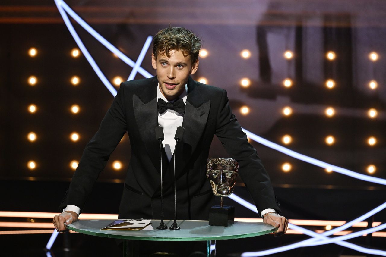 Austin Butler accepts the leading actor award for his performance in "Elvis" on Sunday, February 19, in London.  