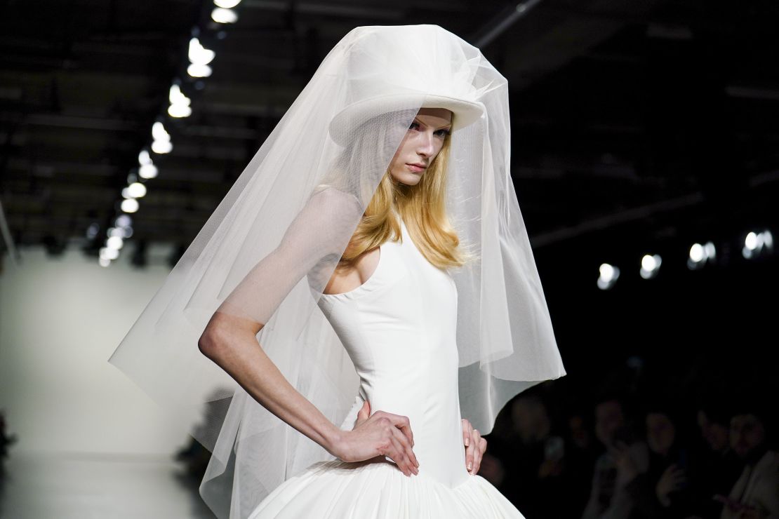 Connor Ives' closing look, a bridal dress and white veiled top hat modeled by TikTok influencer Alex Consani, was inspired by a scene from "The Parent Trap."