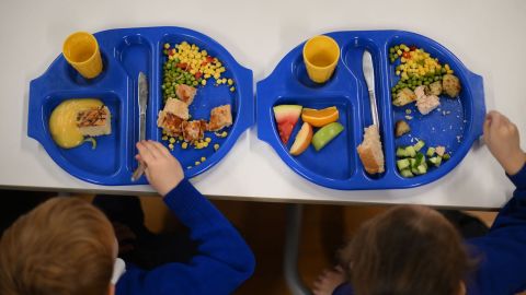 Children eat lunch at St Mary's RC Primary School in Battersea, south London, on November 29, 2022.