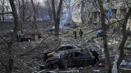 Ukrainian emergency employees work at a maternity hospital damaged by shelling in Mariupol, Ukraine, Wednesday, March 9, 2022. 