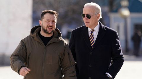 US President Joe Biden (R) walks next to Ukrainian President Volodymyr Zelensky (L) as he arrives for a visit in Kyiv on February 20, 2023.