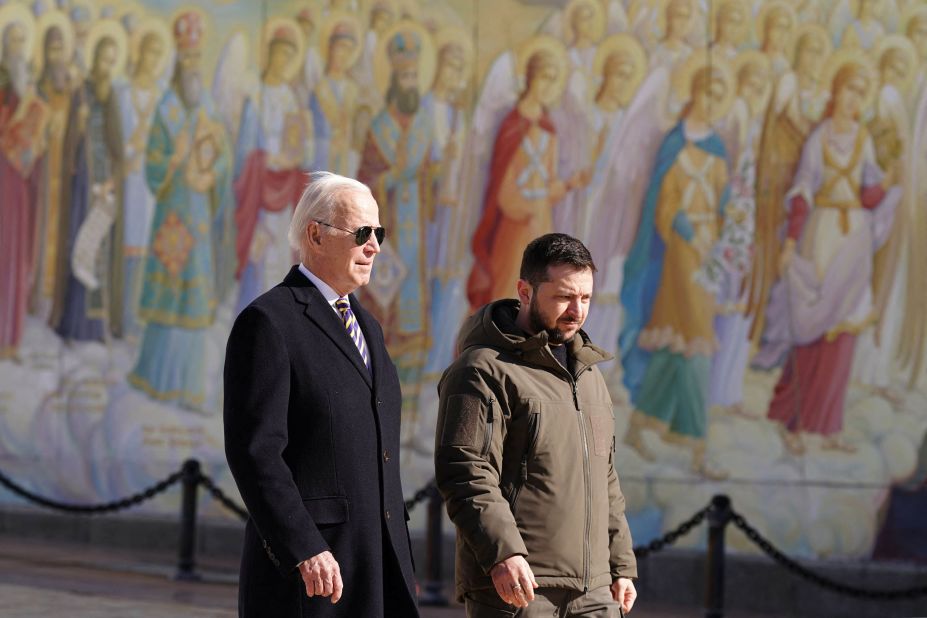 Biden walks next to Zelensky as he arrives for a surprise visit to Kyiv.