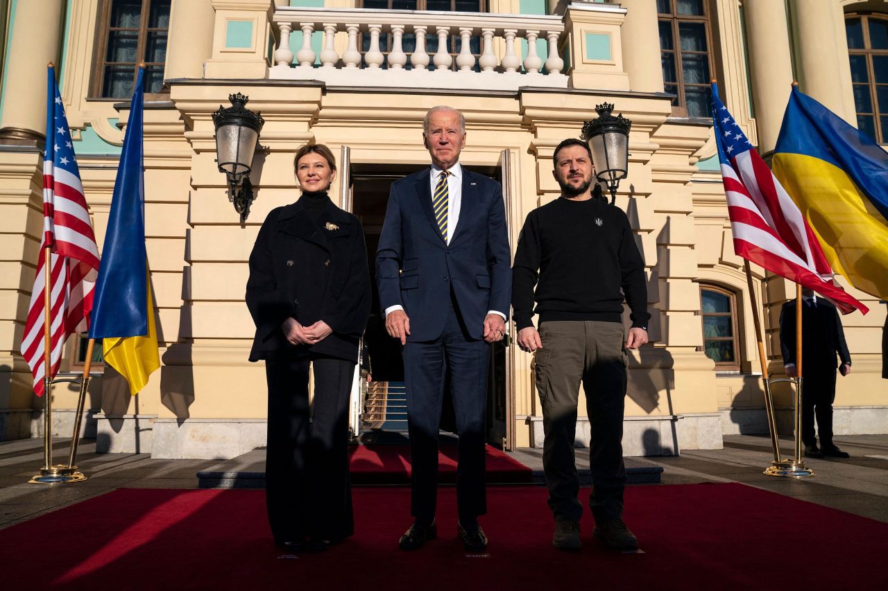 Biden poses with President Zelensky and his wife Olena Zelenska, at Mariinsky Palace in Kyiv.