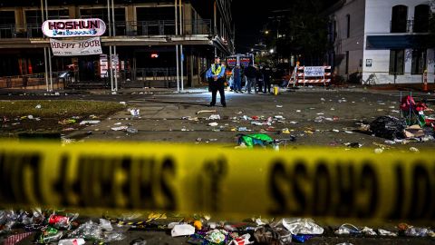 Police investigate a shooting along a Mardi Gras parade route Sunday night in New Orleans.