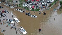 Submerged cars and bicycles in a flooded street on July 21, 2021 in Zhengzhou, Henan Province, China. 