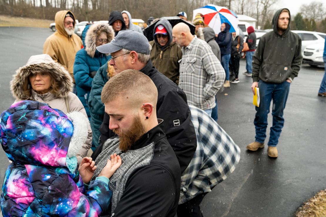 East Palestine residents who had to evacuate wait in line at the Norfolk Southern Assistance Center to collect $1,000 checks and get reimbursed for expenses Friday.