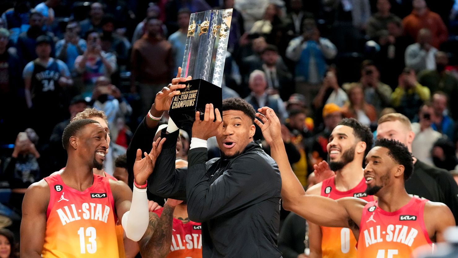 Team captain Giannis Antetokounmpo holds up the winning team trophy after the NBA All-Star game on Sunday night