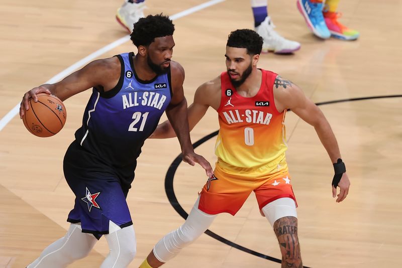Team LeBron center Joel Embiid (21) drives by Team Giannis forward Jayson Tatum (0) during the second half of the NBA All-Star game.