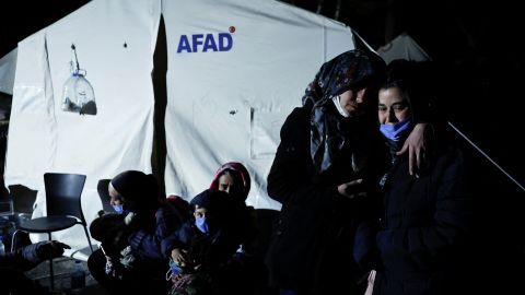 People react after an earthquake in Antakya.