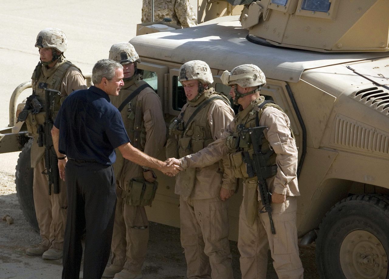 Bush greets troops while visiting an air base in Iraq's Anbar province in September 2007.