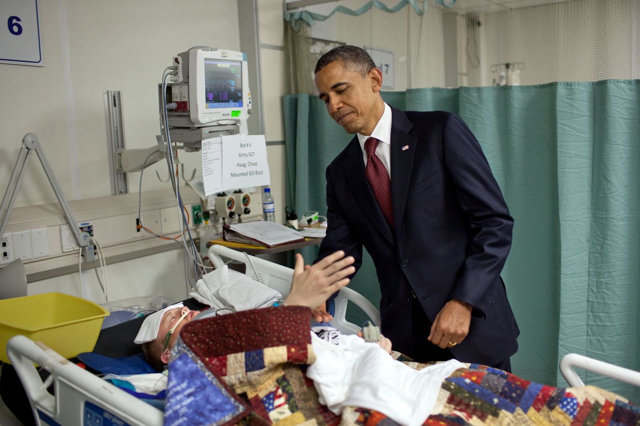 Obama shakes hands with US Sgt. Chase Haag while visiting wounded troops in Afghanistan in May 2012. He presented Haag with a Purple Heart.