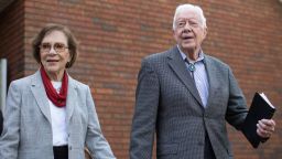 Former President Jimmy Carter walks with his wife Rosalynn after teaching Sunday School class at Maranatha Baptist Church Sunday, Dec. 13, 2015, in Plains, Ga.  A recent MRI showing no cancer on Jimmy Carter's brain is "very positive" news for the former president but will not end his medical treatment, doctors said. Carter, 91, announced Dec. 6 that doctors found no evidence of the four lesions discovered on his brain this summer and no signs of new cancer growth.  (AP Photo/Branden Camp)