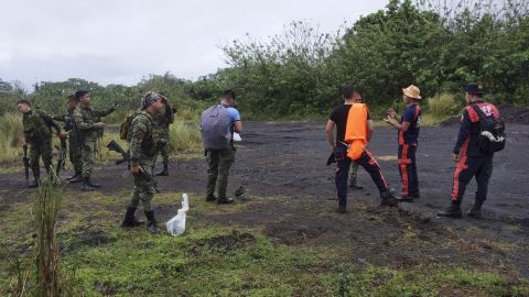 Rescuers prepare to search for the missing Cessna in Albay province, the Philippines, Monday Feb. 20, 2023.