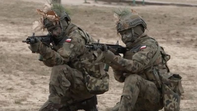 NextImg:'Patriotism is the common denominator': Poland volunteer fighters respond to the war next door | CNN Politics