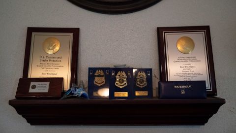 The integrity award Raul Rodriguez won during his tenure at Customs and Border Protection is still so important to him that it's on display in his living room, alongside other awards and badges.