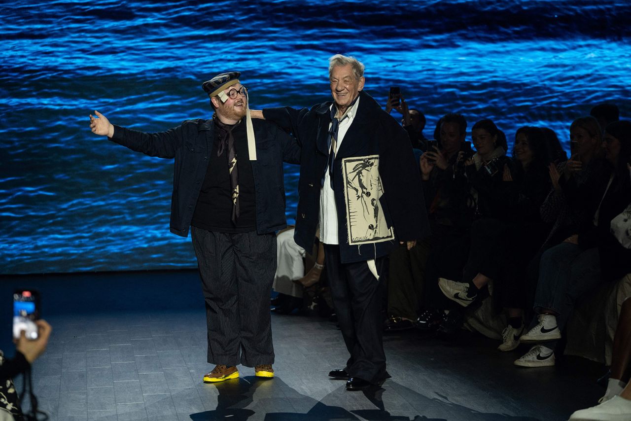 Famed British actor Ian McKellen takes a bow with S.S. Daley designer Steven Stokey-Daley. McKellen performed a surprise reading to open the show.
