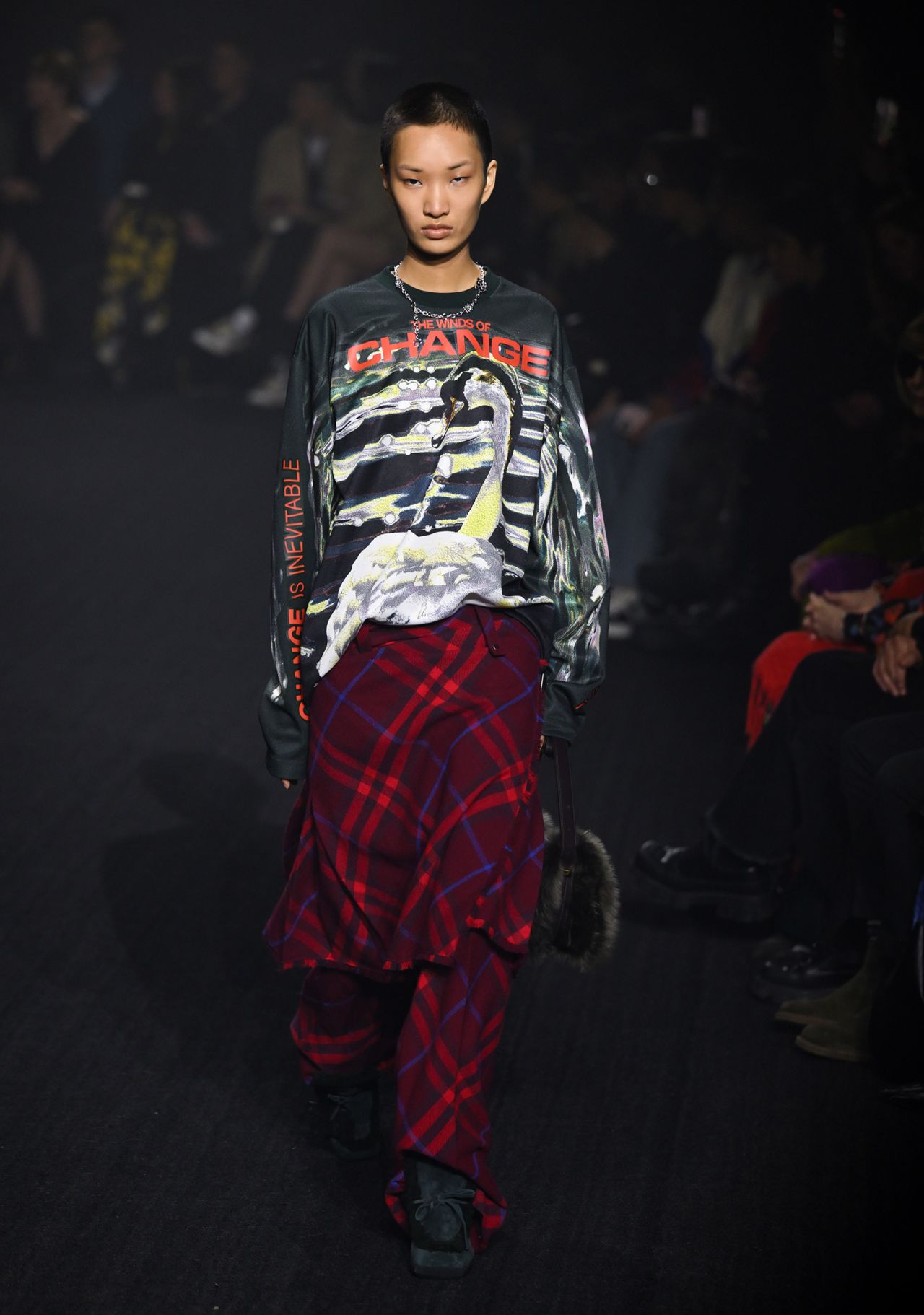 A model walks in a particularly punk-inspired look at Burberry. 