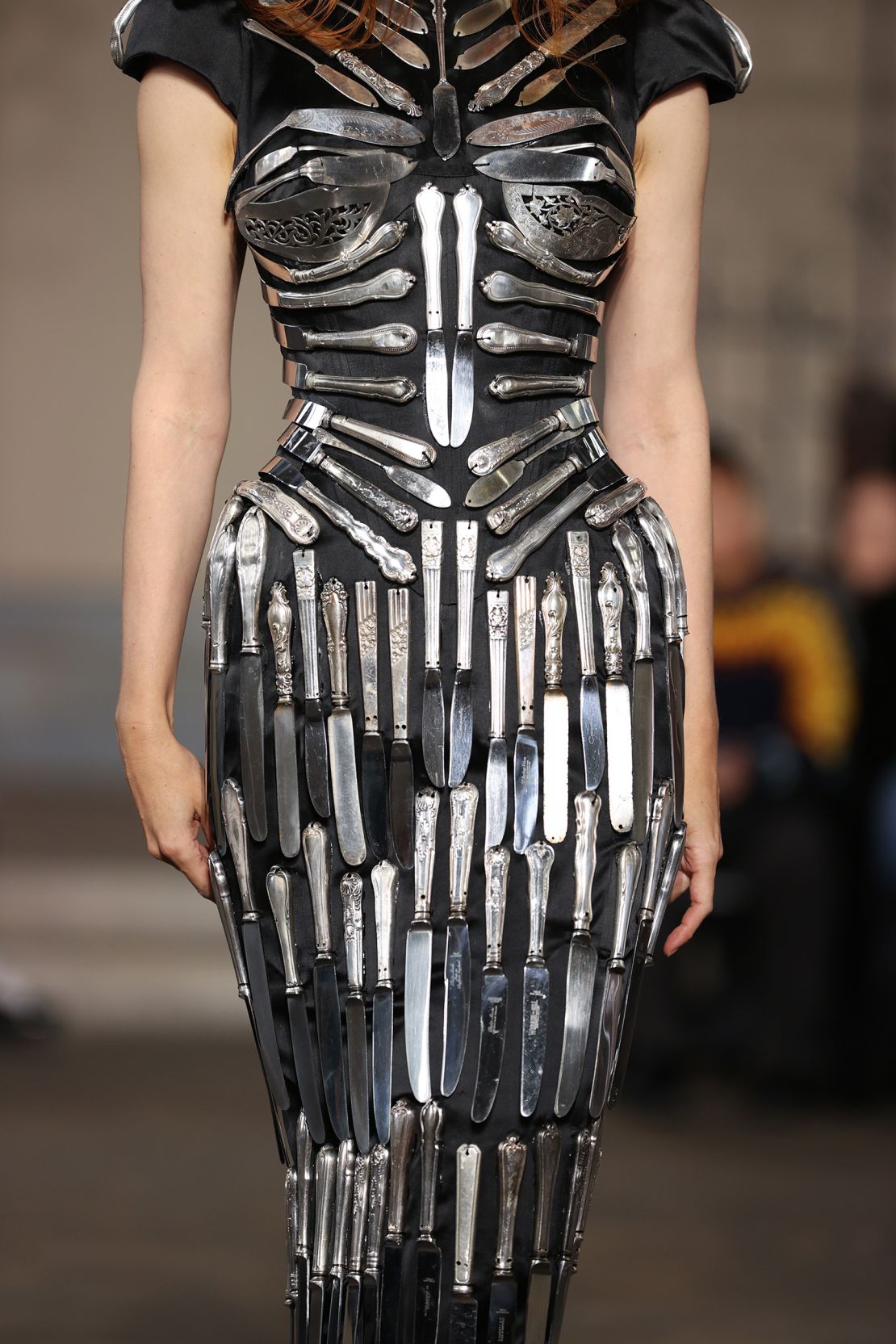 A dress by Dilara Findikoglu embellished with vintage silver knives molded perfectly to the body.
