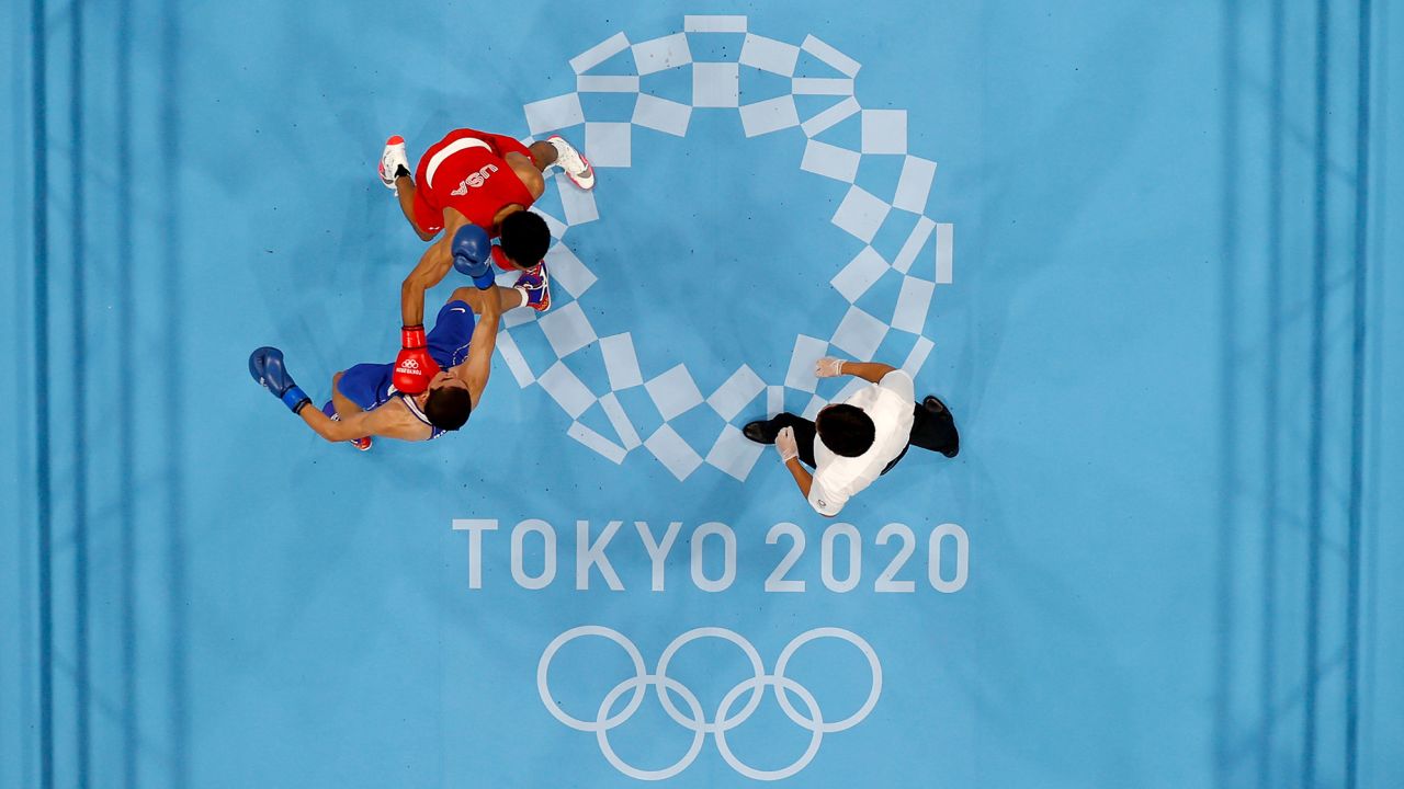 Duke Ragan (red) of Team USA exchanges punches with Albert Batyrgaziev of the Russian Olympic Committee team during the men's featherwieght final on day thirteen of the Tokyo 2020 Olympic Games at Kokugikan Arena on August 5, 2021.