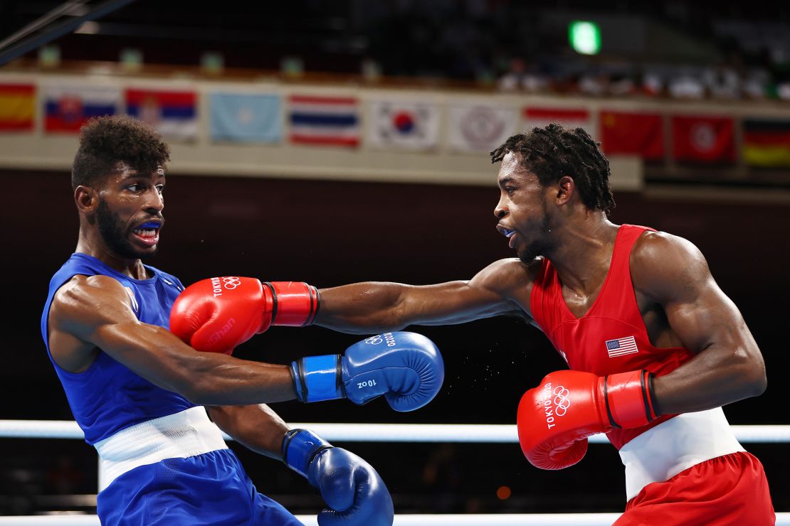 Andy Cruz of Team Cuba dodges a punch from Keyshawn Davis of Team USA during the men's lightweight final at the Tokyo 2020 Olympics.